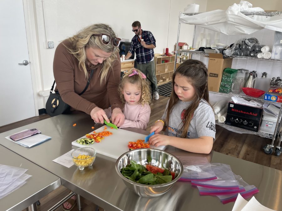 mom cooking - KidsQuest Children's Museum